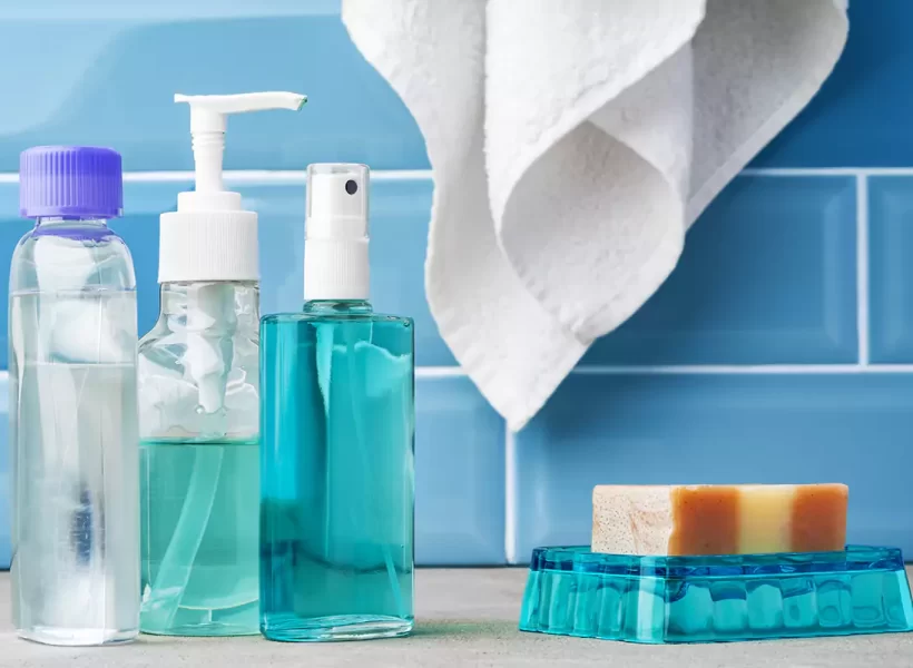 soap-and-toiletries-on-shelf-in-blue-bathroom
